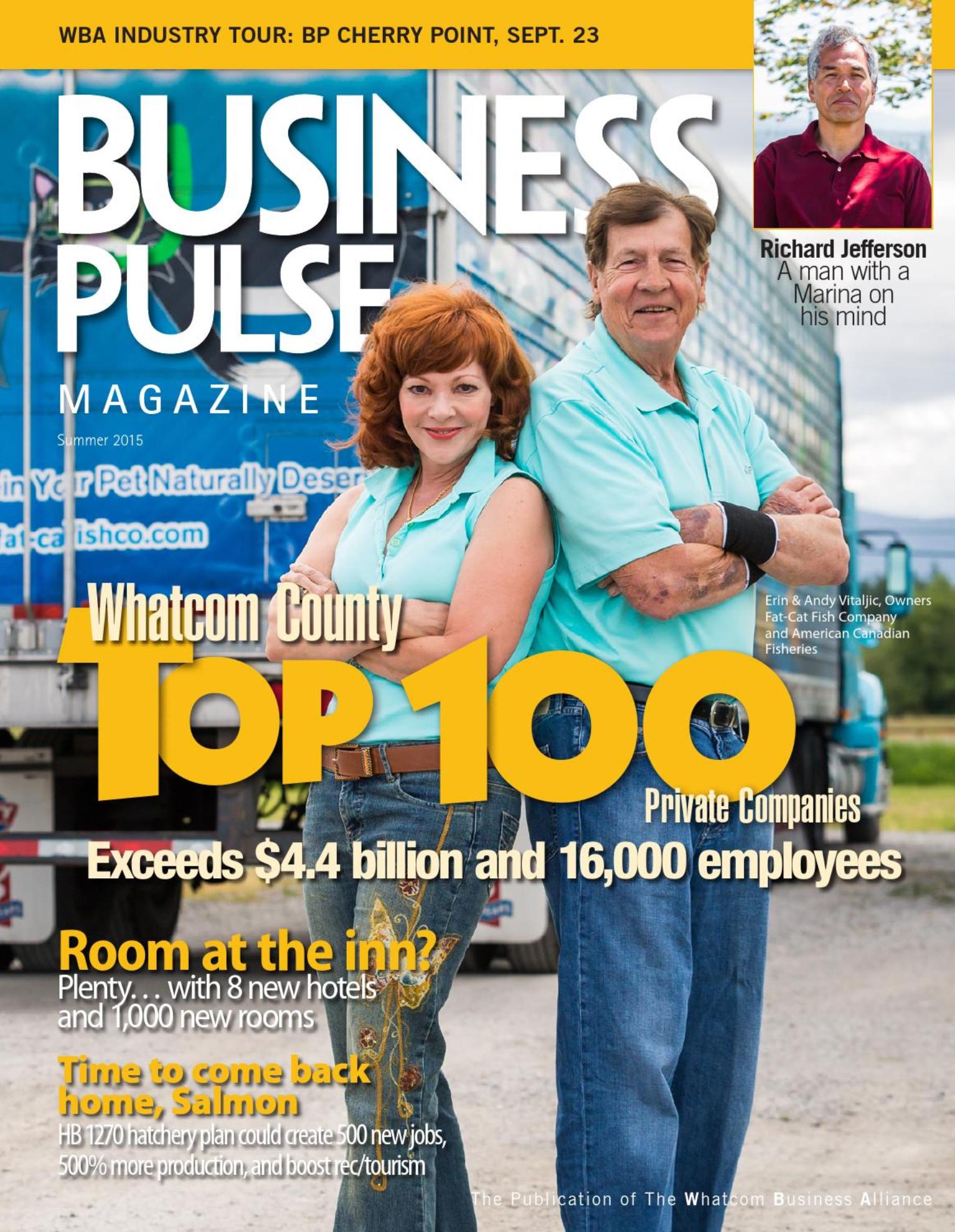 Business magazine cover featuring two company owners in matching teal shirts standing back to back in front of a delivery truck