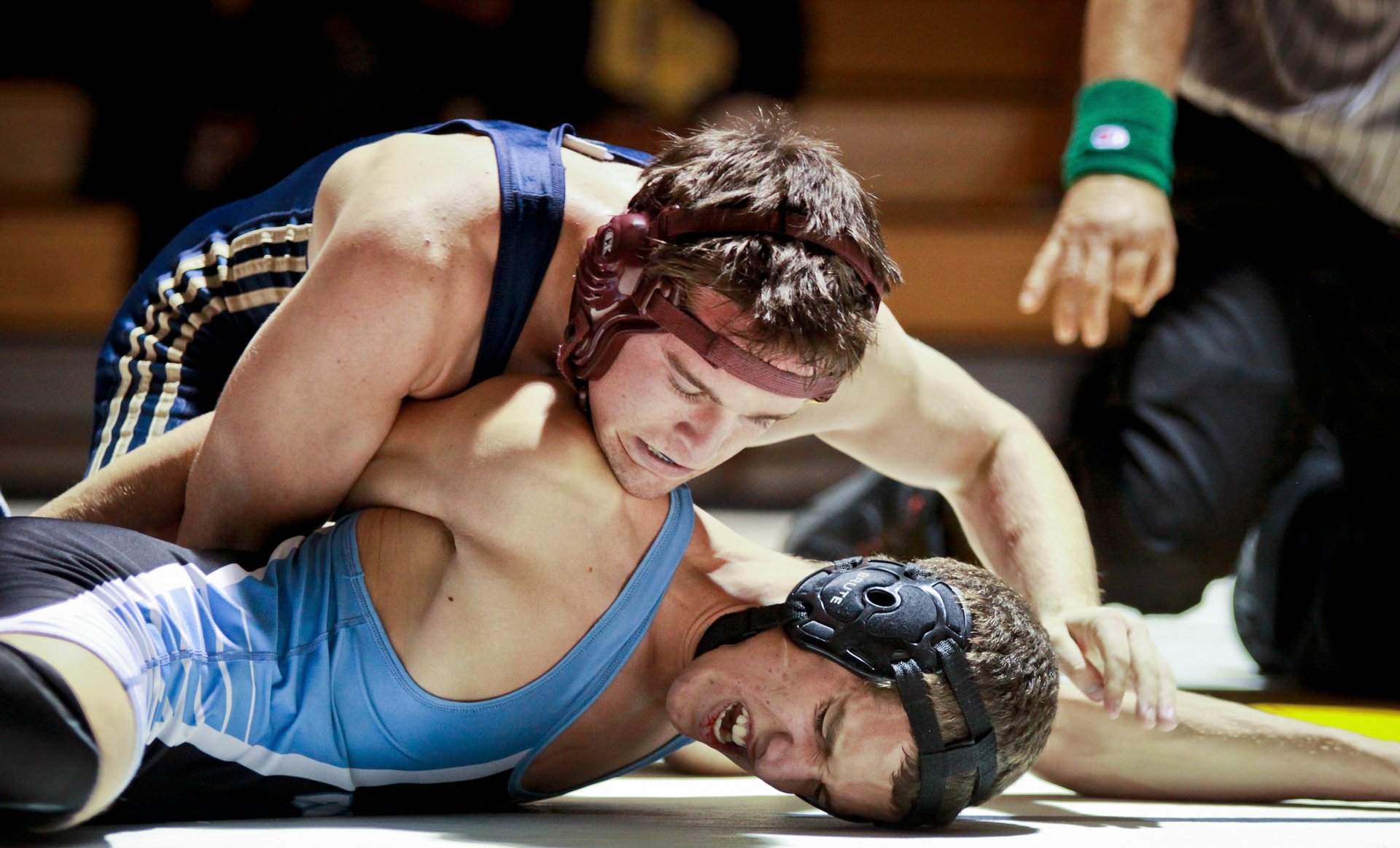 Wrestler pinning an opponent to the mat in a match